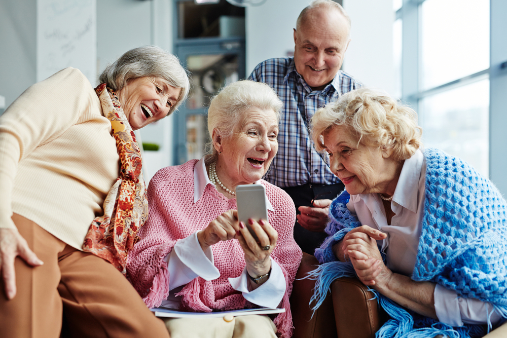 Seniors women fascinated by a smartphone