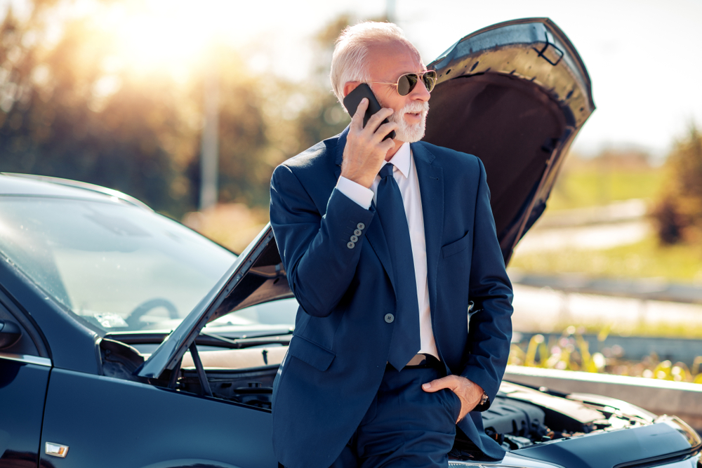 Senior man in call with a car insurance company