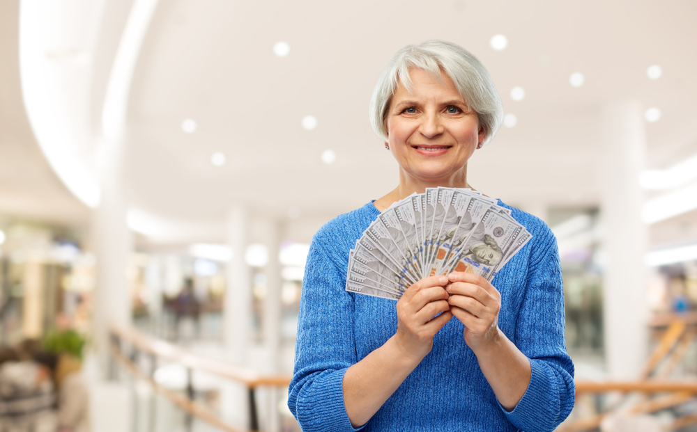 Old woman spending a lot in retirement